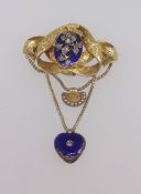 A Victorian gilt drop pendant brooch set with a floral arrangement set with diamonds on blue stone