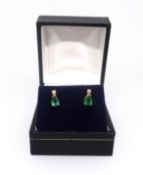 A pair of 18ct emerald and diamond earrings.