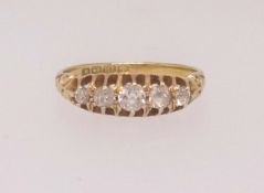 An 18ct five stone diamond ring, size N.