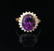 A 9ct amethyst and diamond cluster ring, size O.