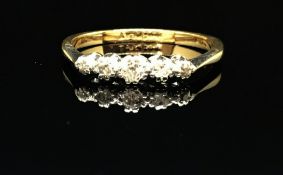 An 18ct platinum five stone diamond ring, size M.