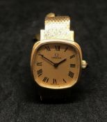 Omega, a ladies 9ct gold wristwatch, automatic with Milanese bracelet, approx 27gms.