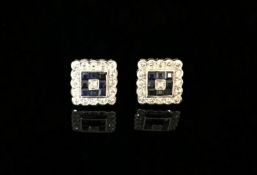 A pair of 18ct white gold square diamond and sapphire earrings.