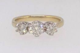 An 18ct diamond three stone ring, approx 0.75ct, size S.