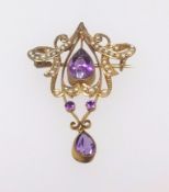 A 9ct pendant of art nouveau design set with amethyst and seed pearl, approx 5.2gms.