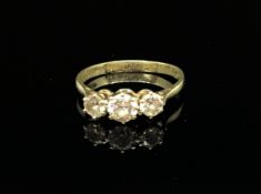 A 9ct three stone diamond ring, size O.