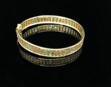 A 9ct gold multi coloured bangle, approx 14.5gms.