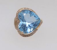 A 14k yellow gold and diamond ring set with a heart shape blue topaz approx 10ct diamonds, approx