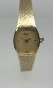 A ladies 14ct gold wristwatch, the dial marked 'Morvant' with sapphire crown, approx 19.4gms.