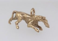 A 9ct gold charm of a hunting dog, approx 21.3gms.