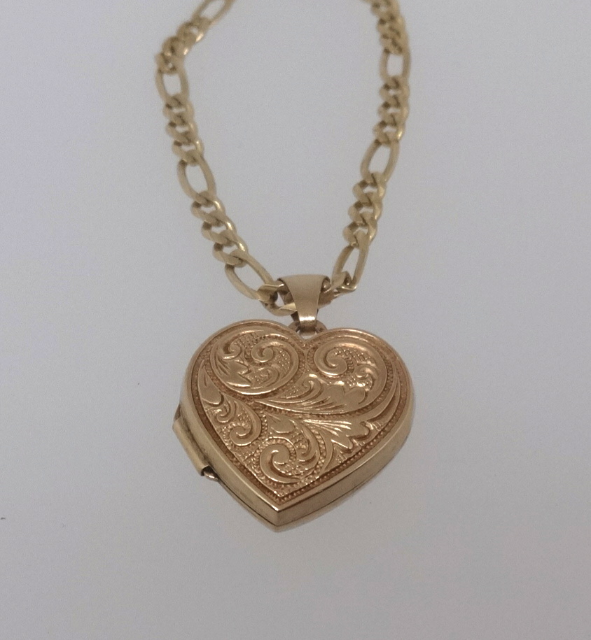 A 14ct gold chain with a gold locket indistinct mark, total weight 10.5gms.