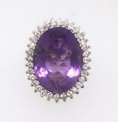 A large amethyst and diamond cluster ring set in white gold, size P.