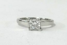 A platinum diamond solitaire ring, set with a square brilliant cut diamond, approx 0.71ct, colour