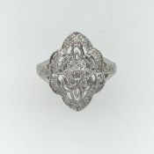 A platinum and diamond set decorative ring, size M.