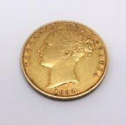 Victoria, an 1882 gold sovereign, marked 'S'.