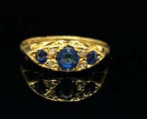 An antique 18ct boat shaped sapphire and diamond ring, size O.