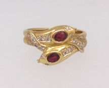 An 18ct yellow gold ruby and diamond snake, size P, approx 6.5gms.