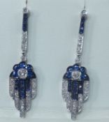 A fine pair of 18ct sapphire and diamond pendant drop earrings in white gold.