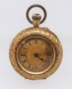 An antique 18ct gold fob watch stamped 18k with keyless movement and decorative case throughout,