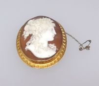 An antique 15ct cameo brooch with a portrait of a lady, height 54mm.