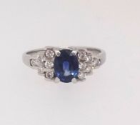A sapphire and diamond set ring, set in 18ct white gold, size M.