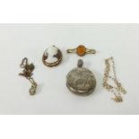 A cameo brooch set in yellow metal, a silver locket, an opal pendant necklace, fine gold chain and a