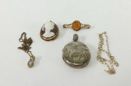 A cameo brooch set in yellow metal, a silver locket, an opal pendant necklace, fine gold chain and a