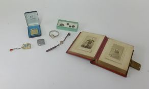 A collection of two ladies vintage wristwatches, a Victorian photograph album,