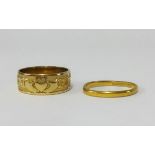 A 9ct wedding band (2.5gms) and a 22ct wedding band (4.7gms).