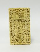 An antique carved ivory card case, deeply carved on all sides with figures, trees and buildings,