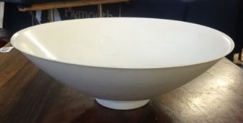 A Chinese celadon shallow bowl, diameter 21cm.