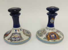 A pair of Wade rum decanters, one English and one American.