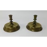 A pair of 19th century Flemish brass candlesticks with circular bases and turned stems, height