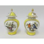 A pair of 19th/20th century porcelain vases with underglaze blue mark and covers decorated with