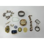 A box of various costume jewellery etc including silver charm bracelet.