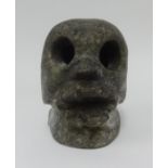An unusual heavy stone 'Skull', height 16cm.