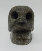 An unusual heavy stone 'Skull', height 16cm.