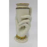 A Worcester unglazed porcelain vase and modelled in the form of a hand and urn, height 16cm.