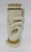 A Worcester unglazed porcelain vase and modelled in the form of a hand and urn, height 16cm.