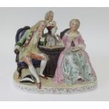 A Meissen style porcelain group of figures in period costume playing chess, height 20cm.
