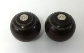 A pair of commemorative bowling bowls.