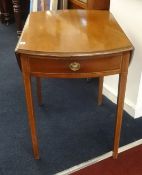 A mahogany pembroke table with inlaid decoration.