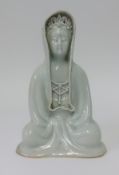 An Asian porcelain Buddha, height 27cm.