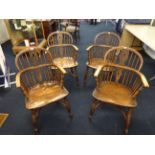Four late 19th/early 20th century Windsor elm and beech farmhouse chairs.