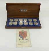 'The Royal Arms' set of 12 Silver Proof medals, issued by the Danbury Mint to celebrate the Queens