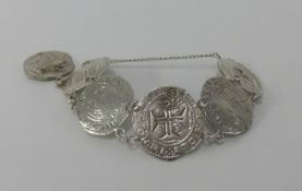 A coin bracelet set with antique coins from The San Pedro Mayor/St Peter The Great Ship stranded