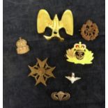 A collection of military badges including WWII German, Parachute sterling silver badge, ARP, RAF etc