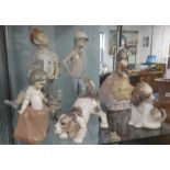 A collection of three Nao figures and three Lladro figures including two dogs (6).