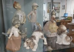 A collection of three Nao figures and three Lladro figures including two dogs (6).