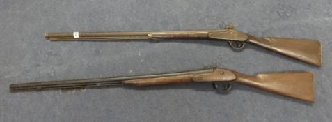 Two antique shot guns.